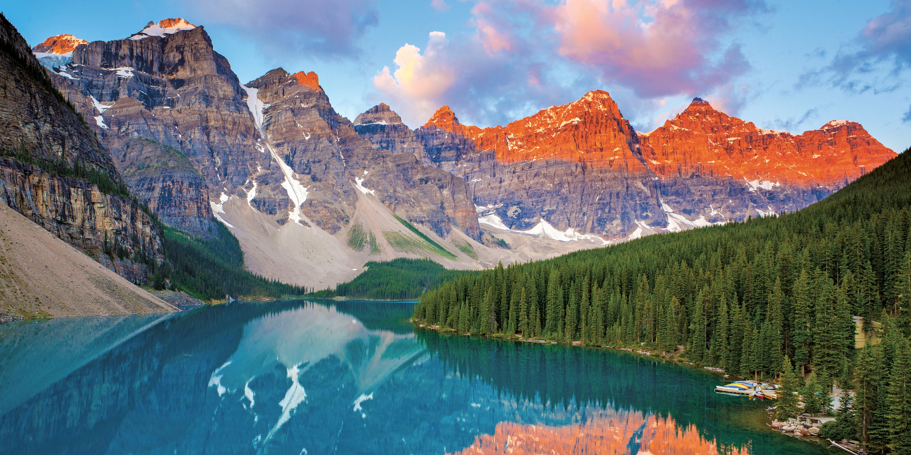 View of Lake Banff in Canada with the sun hitting the peaks of the mountains
